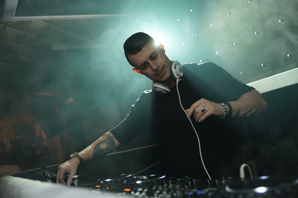 why do DJs wear headphones - cueing